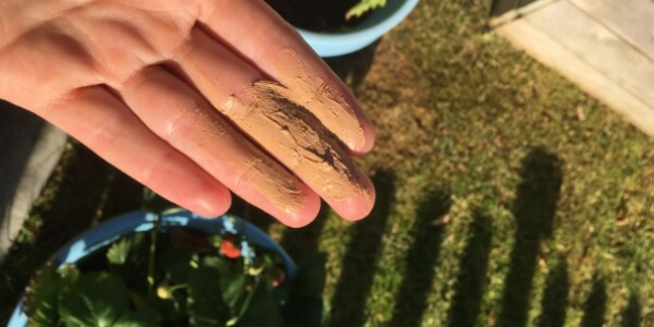 Some mineral sunscreen on a hand.